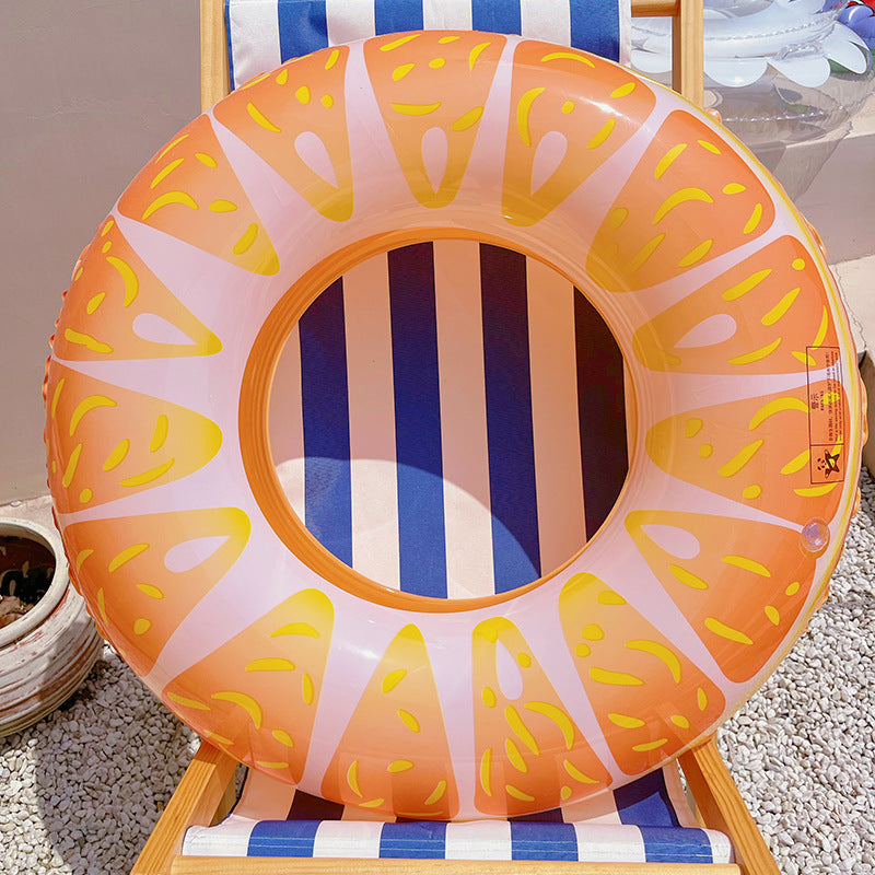 Inflatable swim ring with colorful design on a striped chair