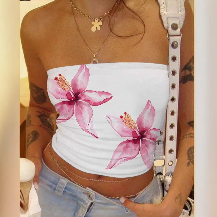 White tube top with pink floral design worn by a person.