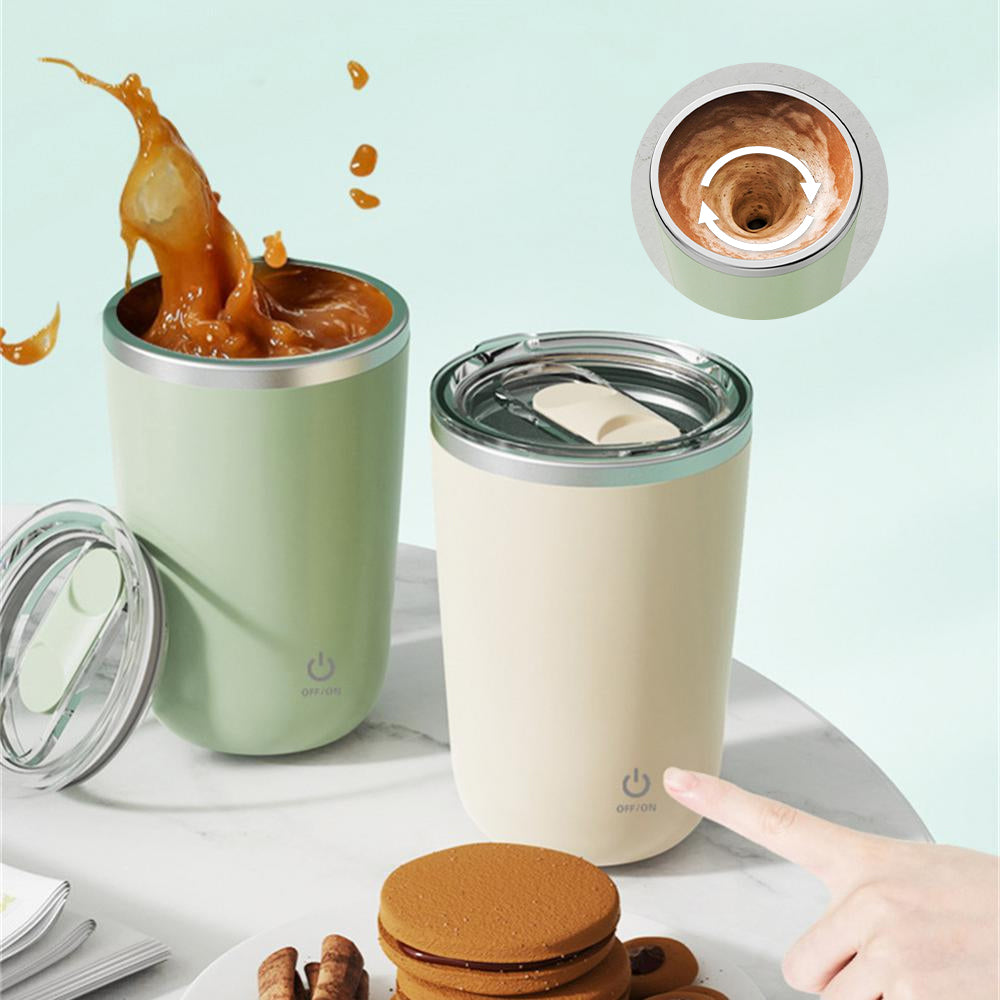Two insulated travel mugs with a hand pointing at one, on a light blue background.