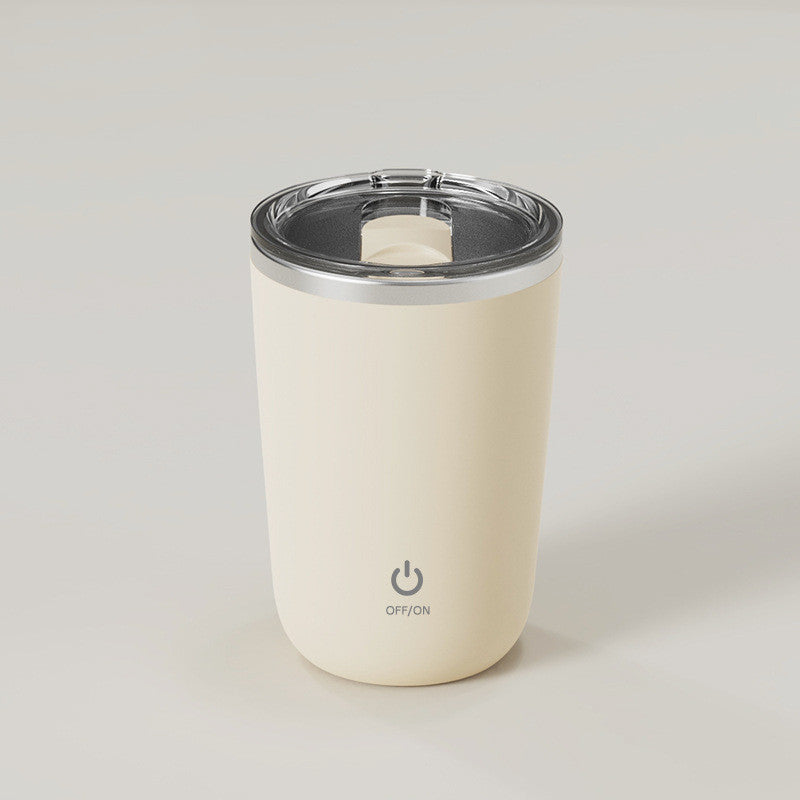 Cream tumbler with a silver lid on a light gray background