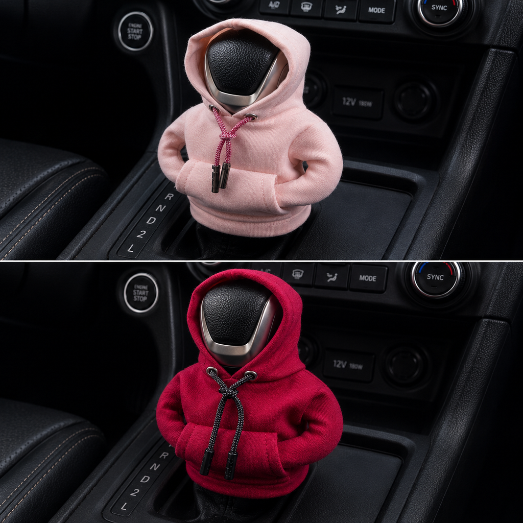 Car gear shift cover with pink and red hoodies on a black car interior.