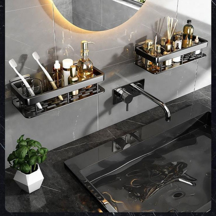 Modern bathroom vanity with sink, faucet, and decorative items.