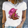 White women's cotton t-shirt featuring a western cowgirl pink hat and floral boots graphic print