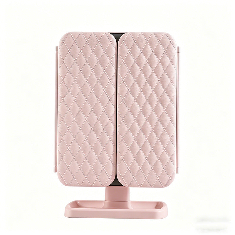 Pink quilted folding mirror on a white background